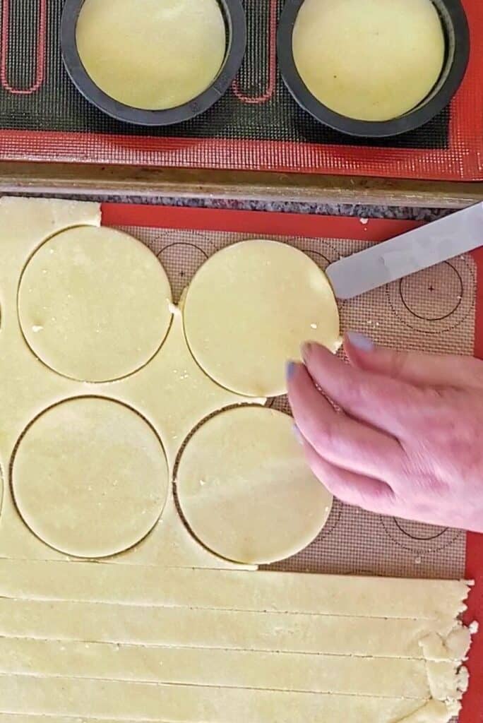 removing circles from silicone mat using an offset spatula.