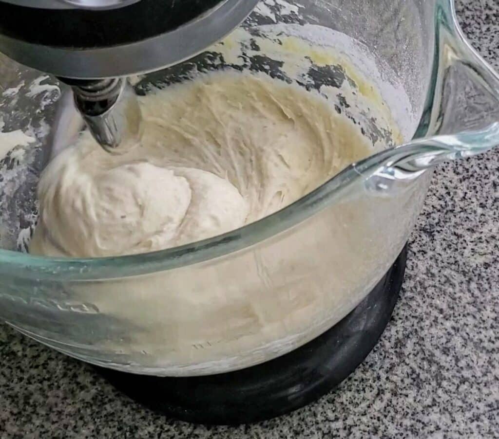mixing dough using dough whisk and kitchenaid mixer.