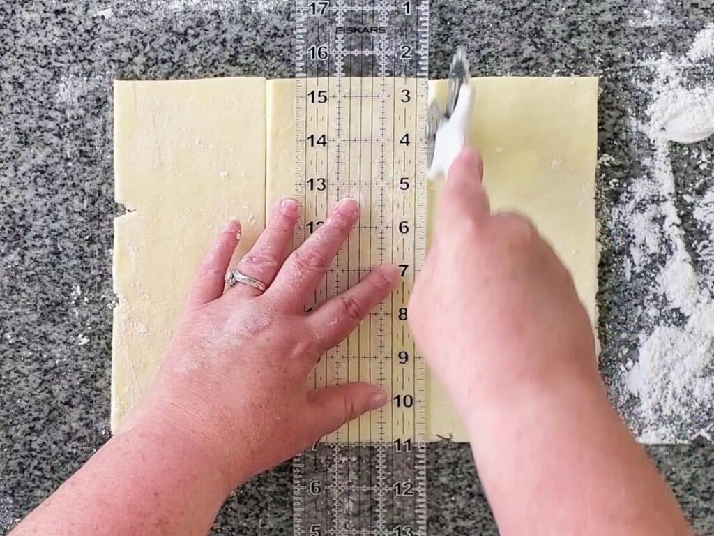 cutting dough into thirds.