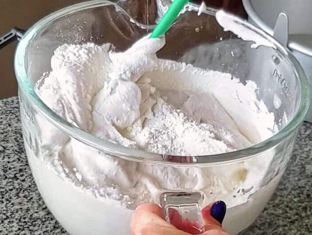 folding the flour mixture into the egg whites.