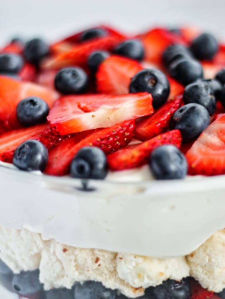 close up of berries on top of gluten free trifle recipe.