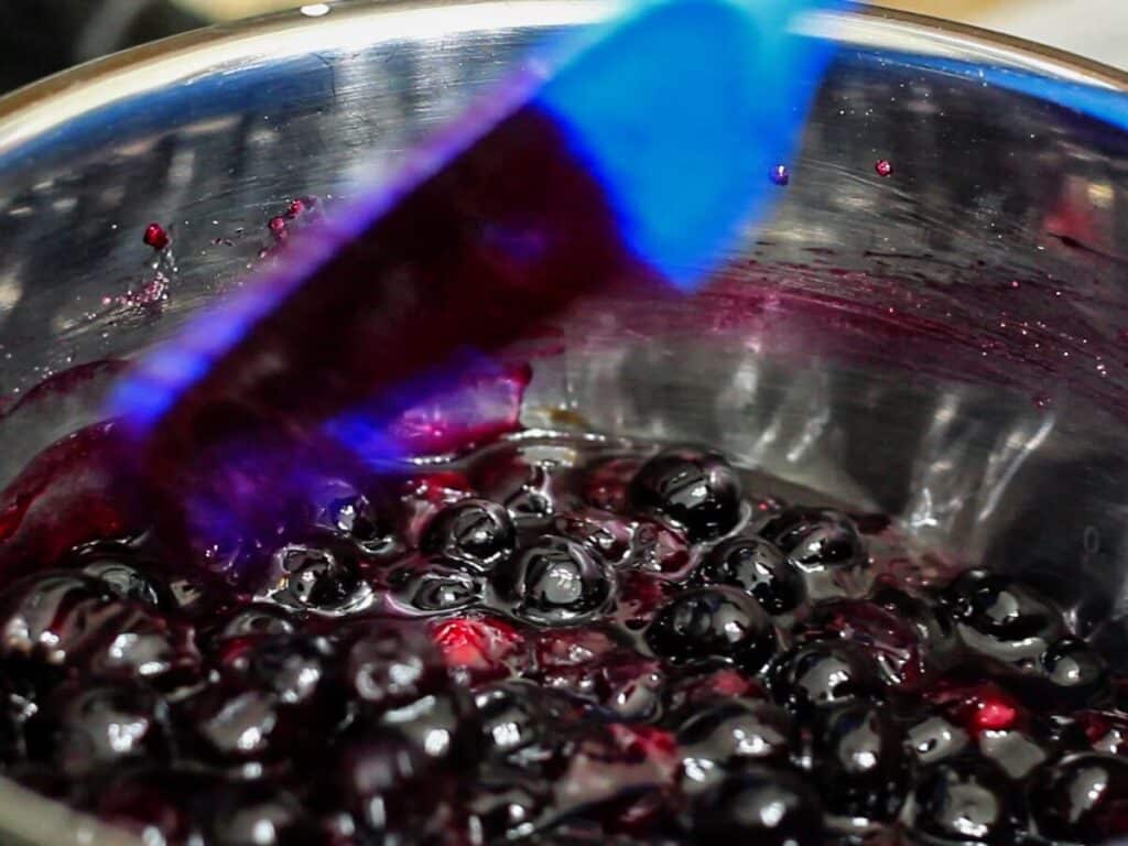 thickened blueberry compote in saucepan.