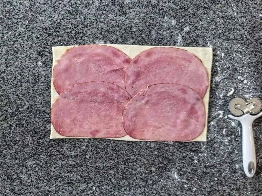ham in single layer on dough rectangle.