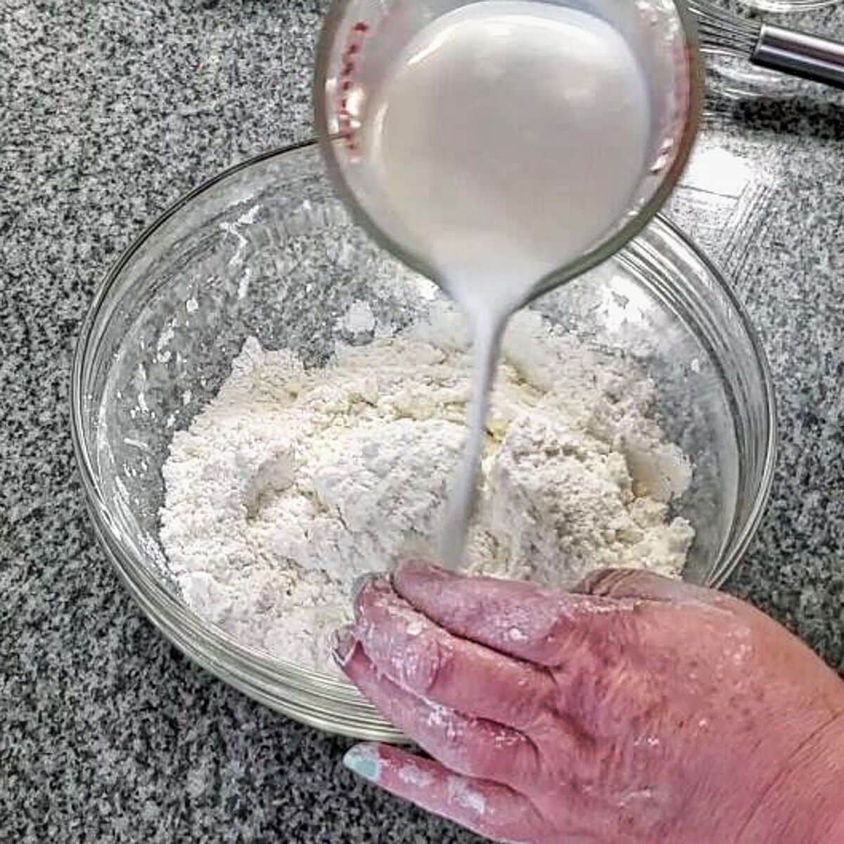 pouring milk into bowl.