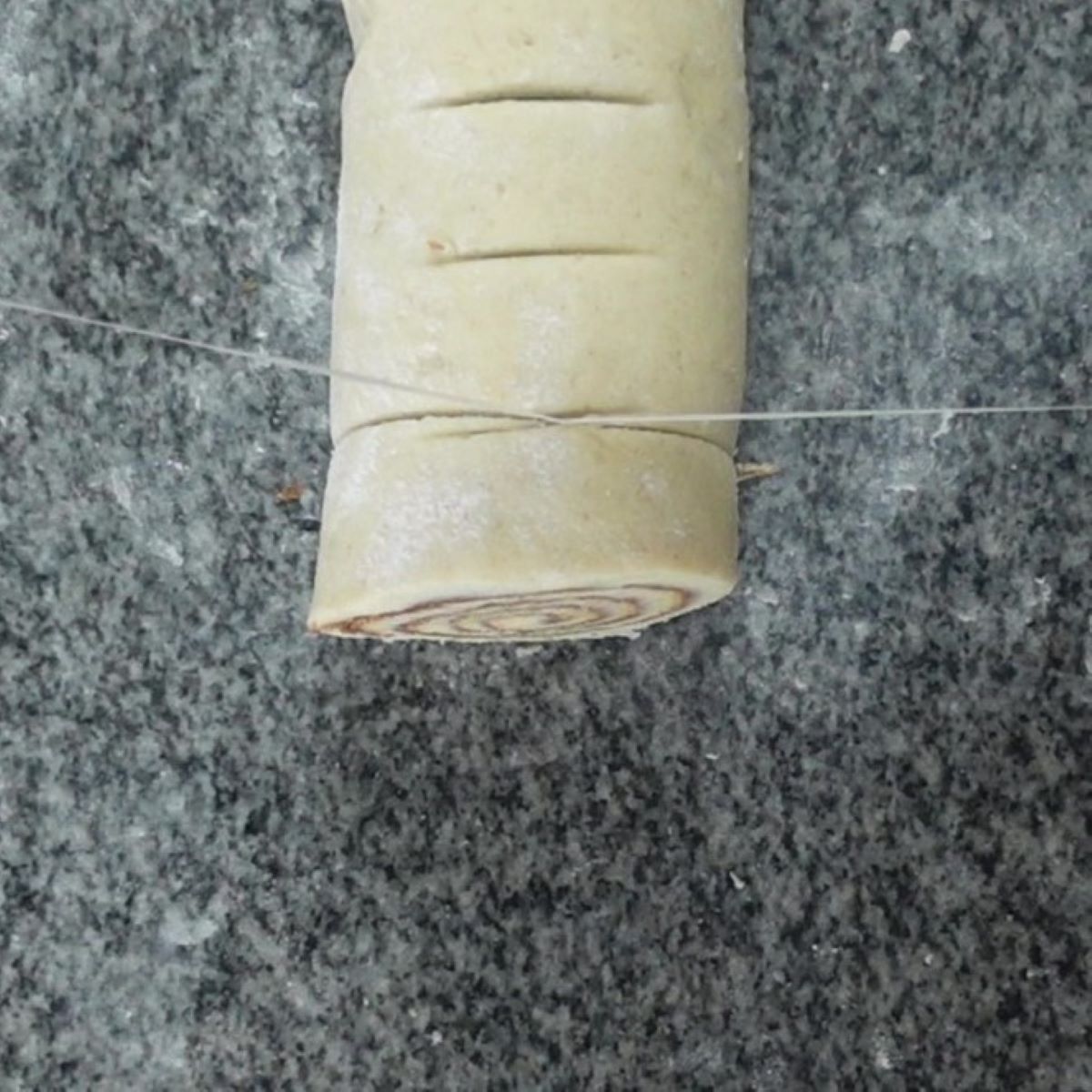 cutting rolls with dental floss.