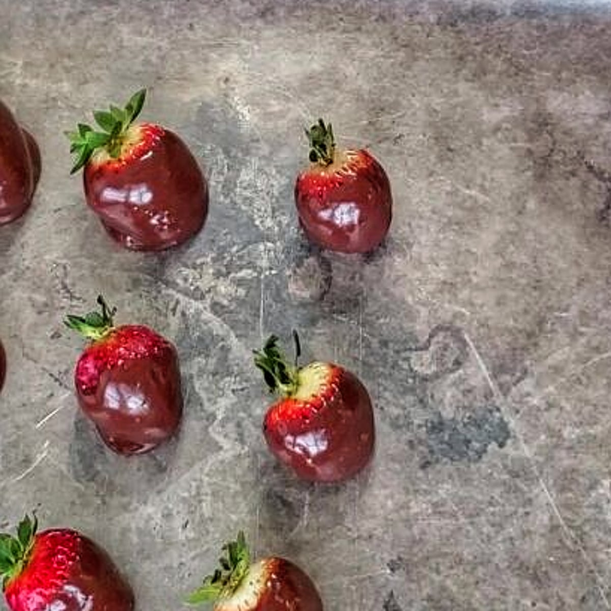 dipped strawberries on waxed paper-lined baking sheet.