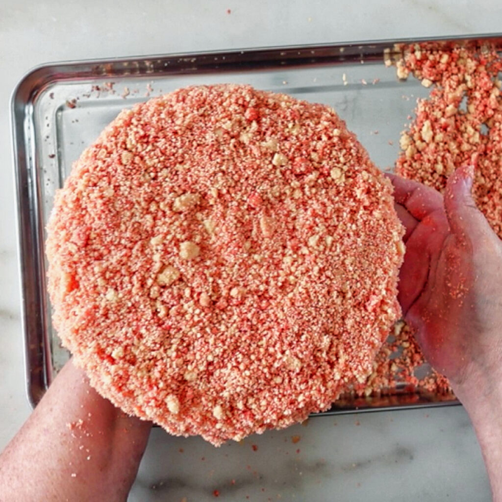 strawberry crunchies all over cake.