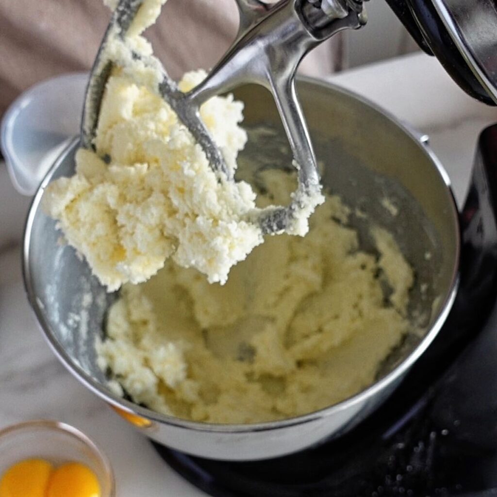 creaming butter and sugar together in bowl of stand mixer.