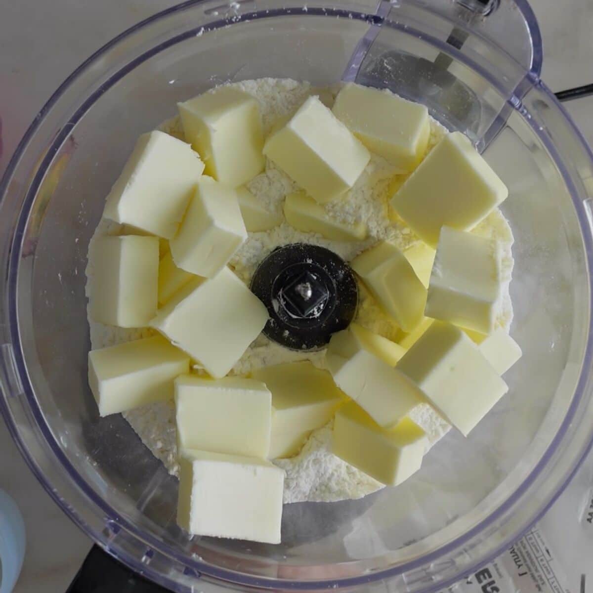 cold butter chunks on top of flour in food processor bowl.