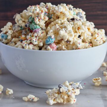 white chocolate popcorn in large white bowl.