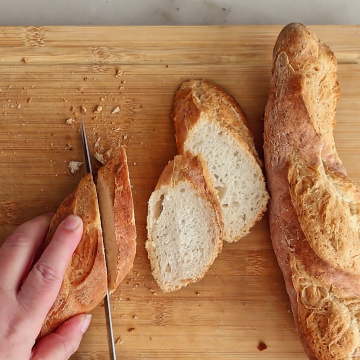 cutting baguettes into crostini.