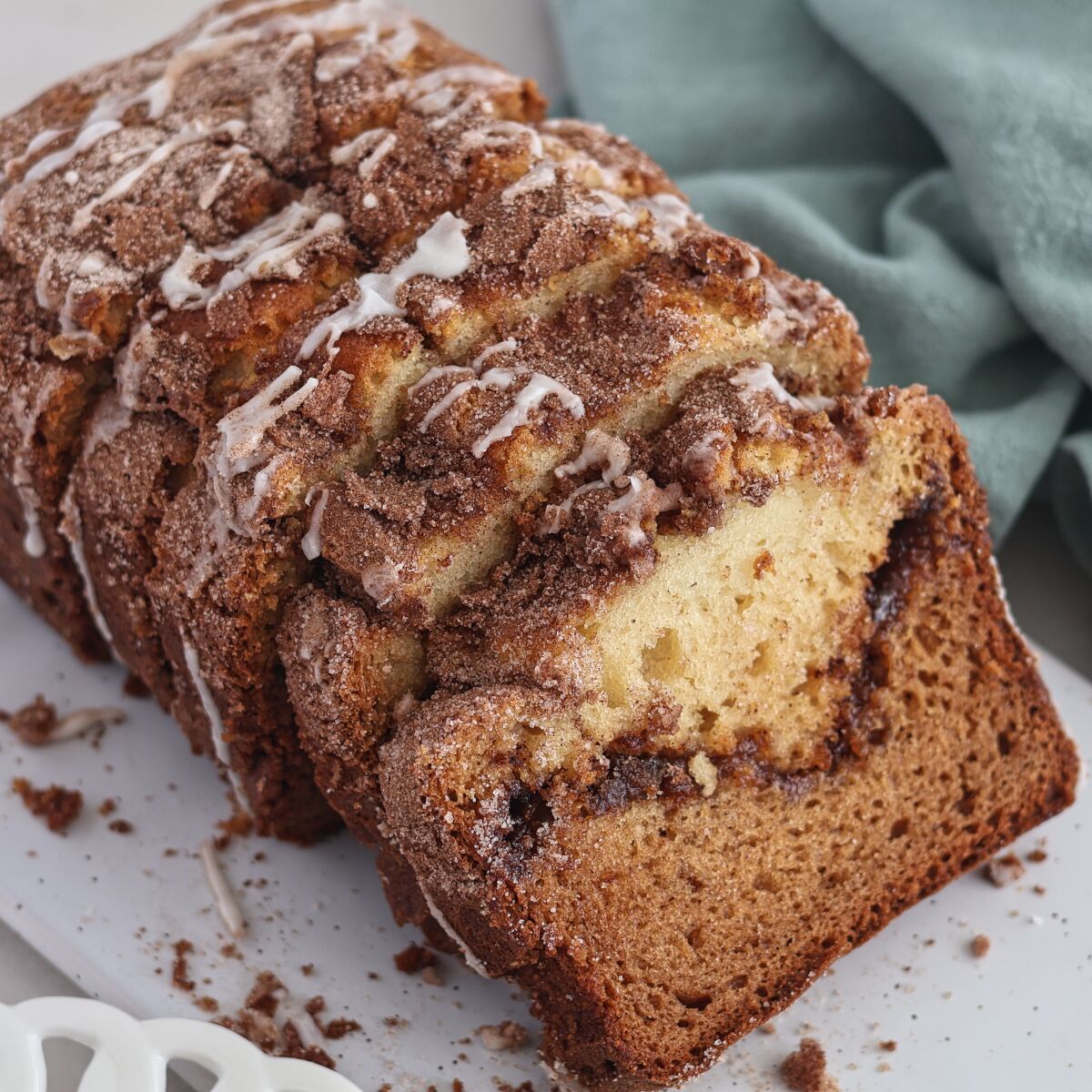 loaf of cinnamon bread sliced and placed on an angle.