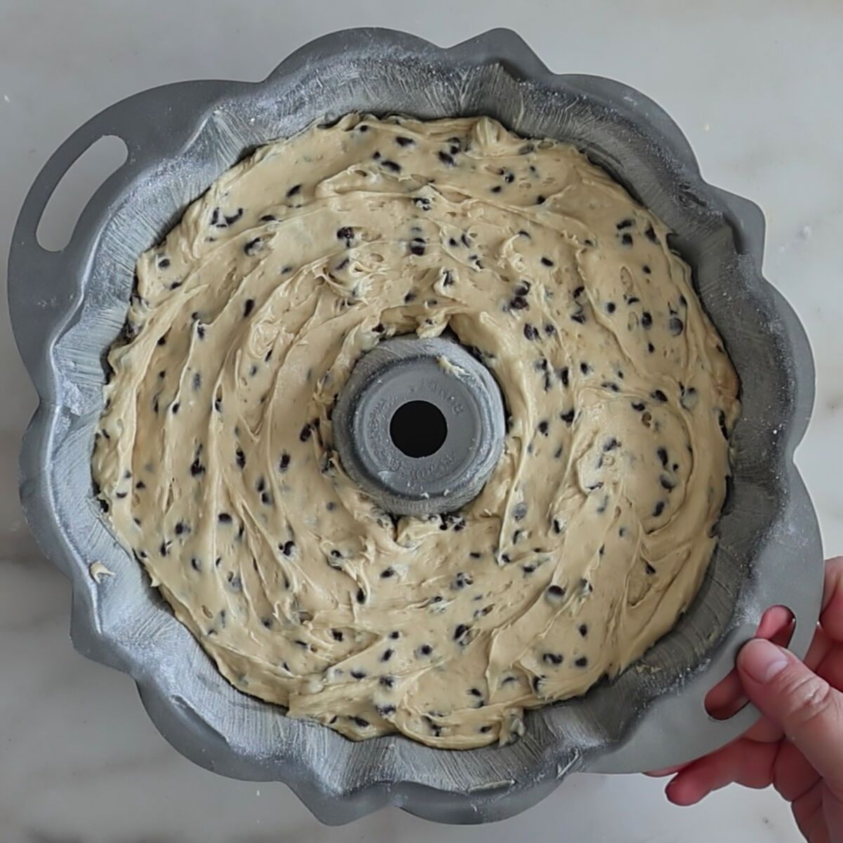 batter in bundt pan smoothed on top.