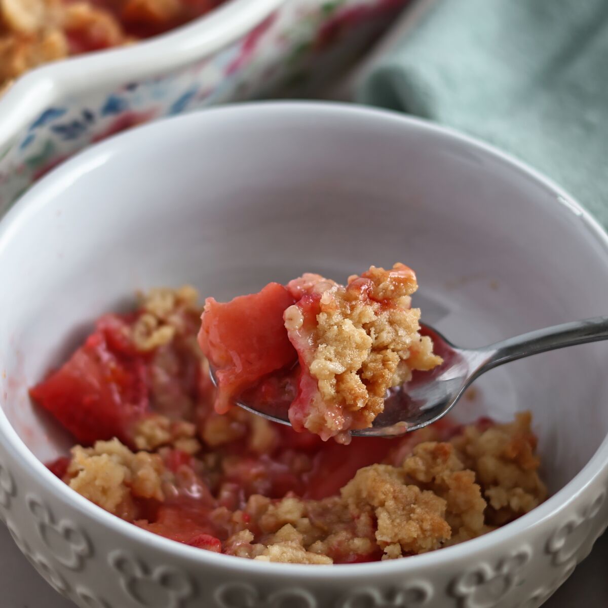 bowl full of strawberry rhubarb crisp.