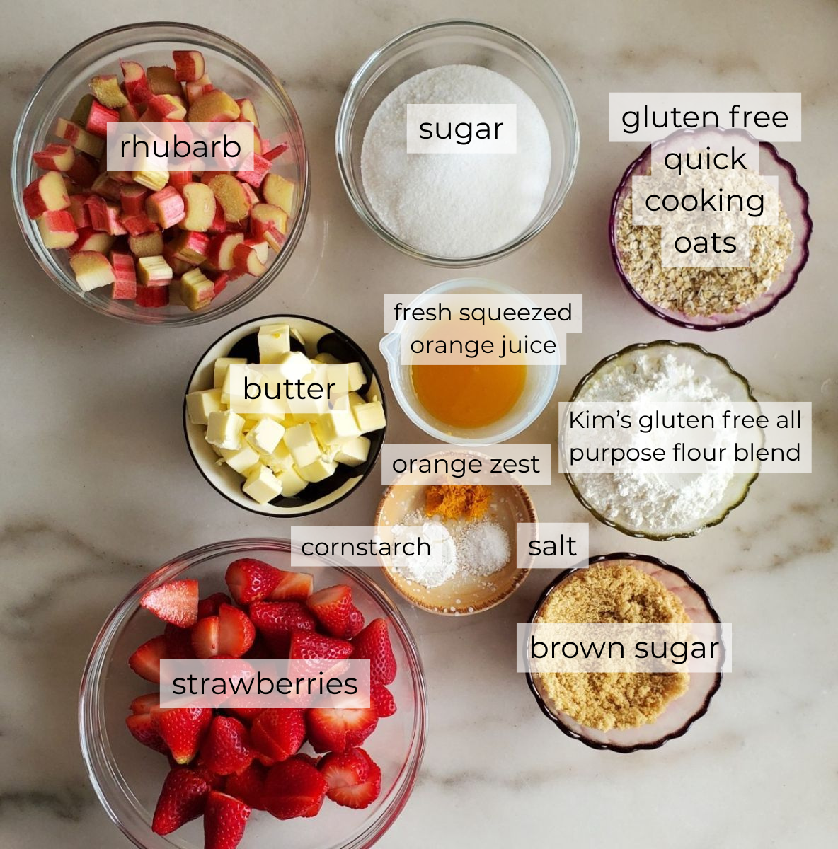 ingredients measured out and labeled on white marble surface.