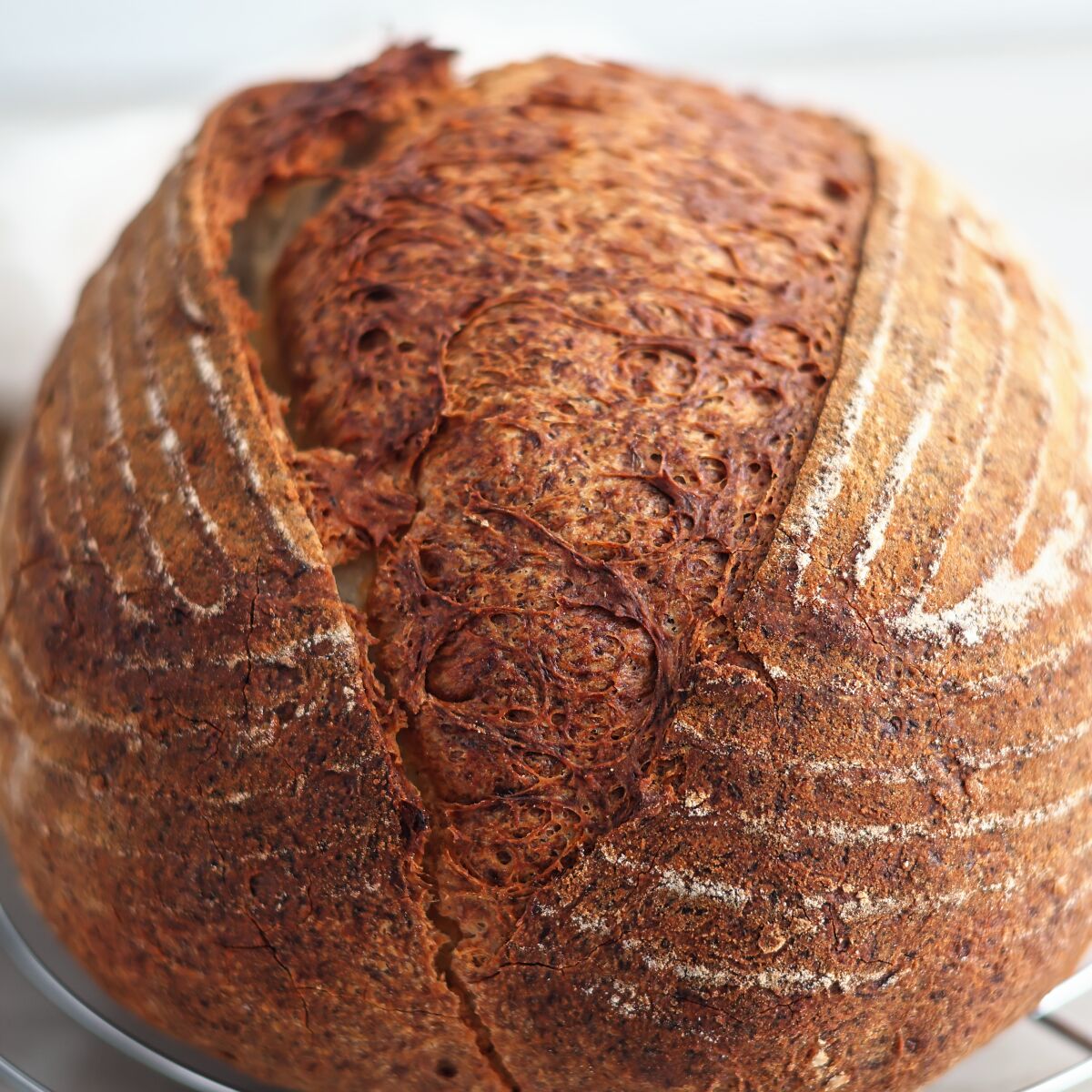 side view of whole loaf of sourdough.