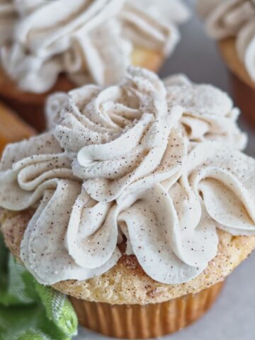 up close picture of gluten free churro cupcakes.