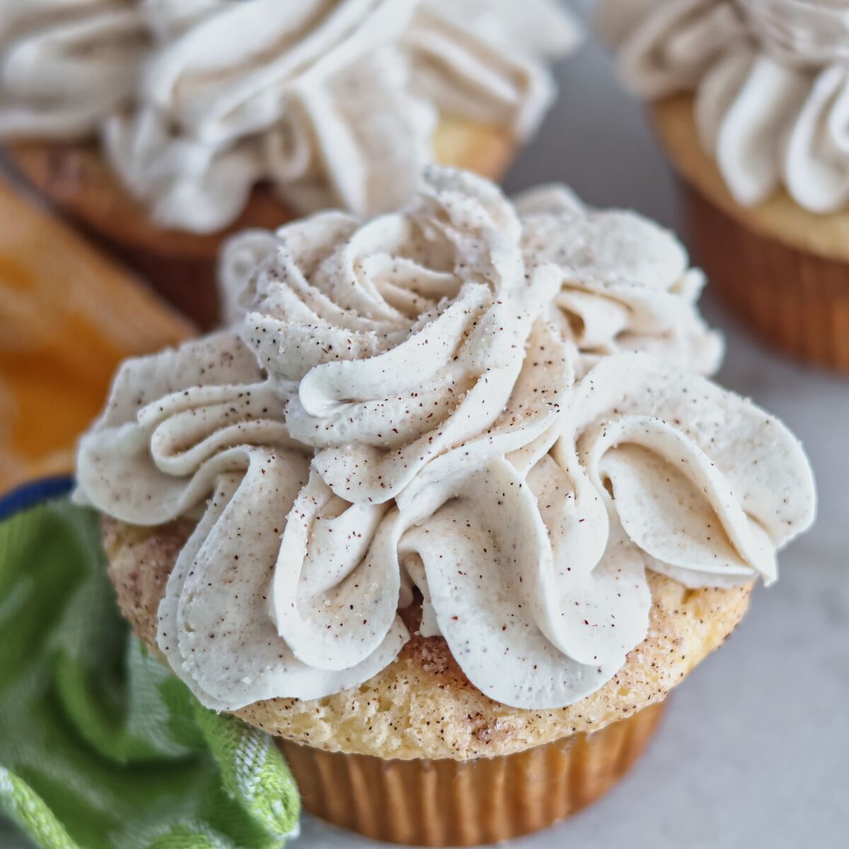 up close picture of gluten free churro cupcakes.