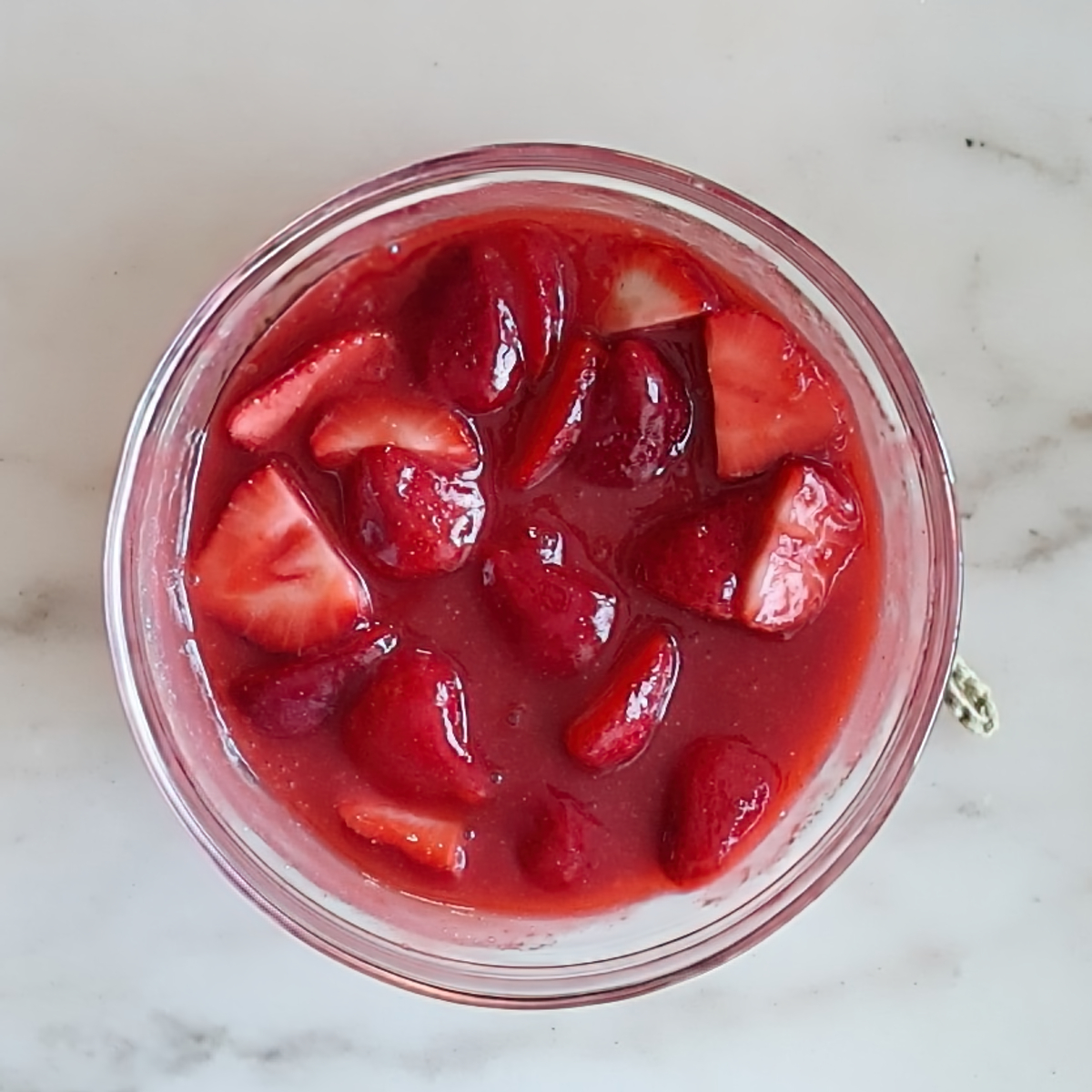 strawberry topping in small glass bowl.