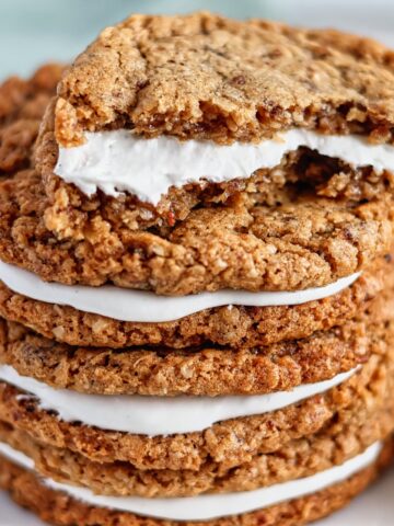 half of an oatmeal creme pie stacked on top of two more.