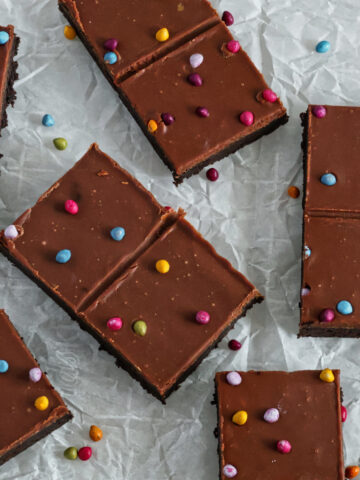 cosmic brownies scattered out on a piece of white crumpled parchment paper.