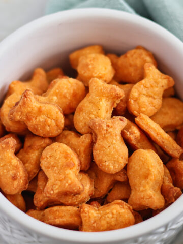 white bowl filled with goldfish.