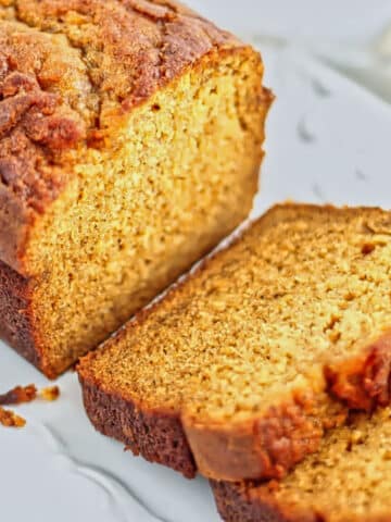 loaf of pumpkin bread with a few slices.
