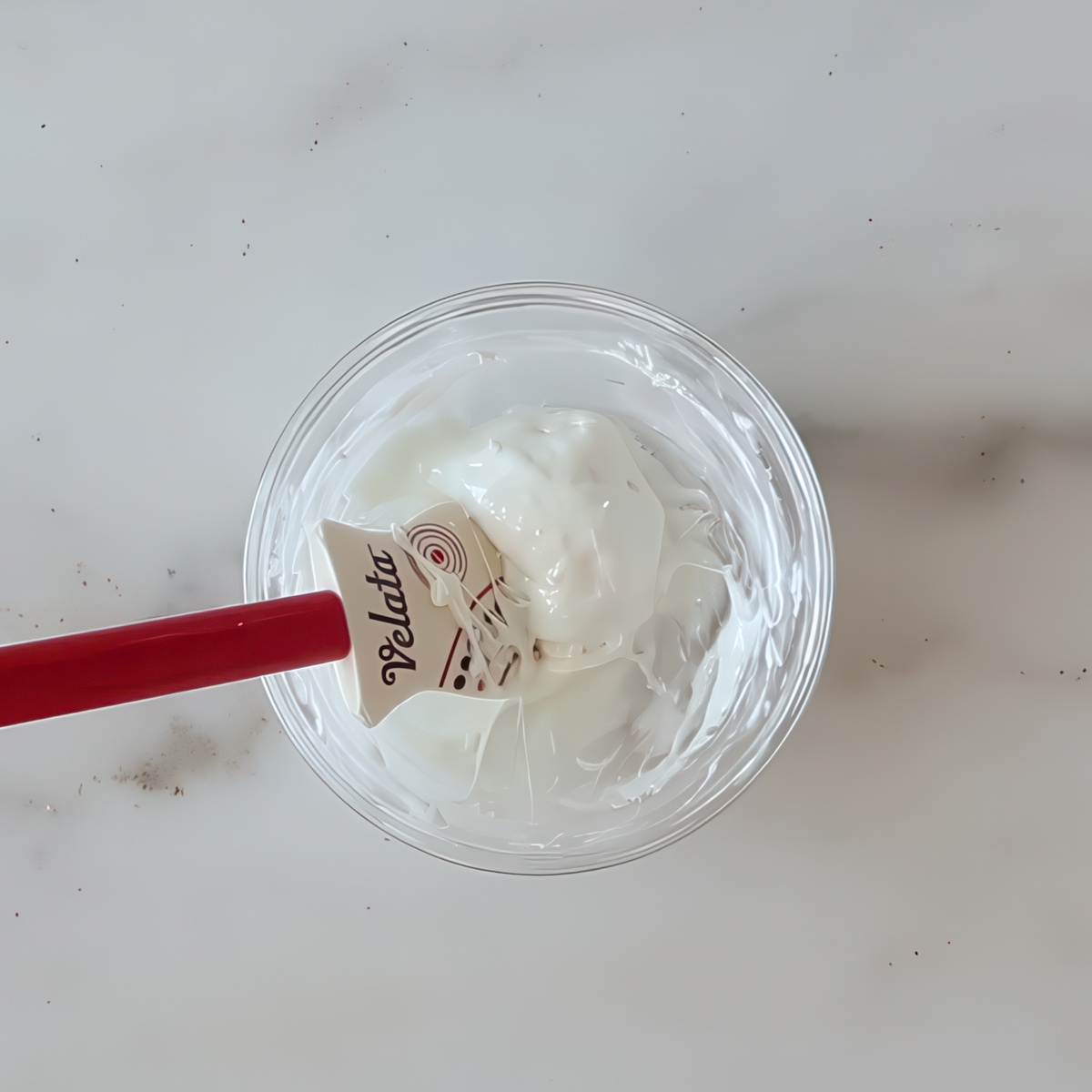 melted marshmallow in small glass bowl.