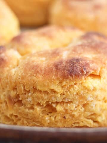 tall sweet potato biscuit close up in pan.